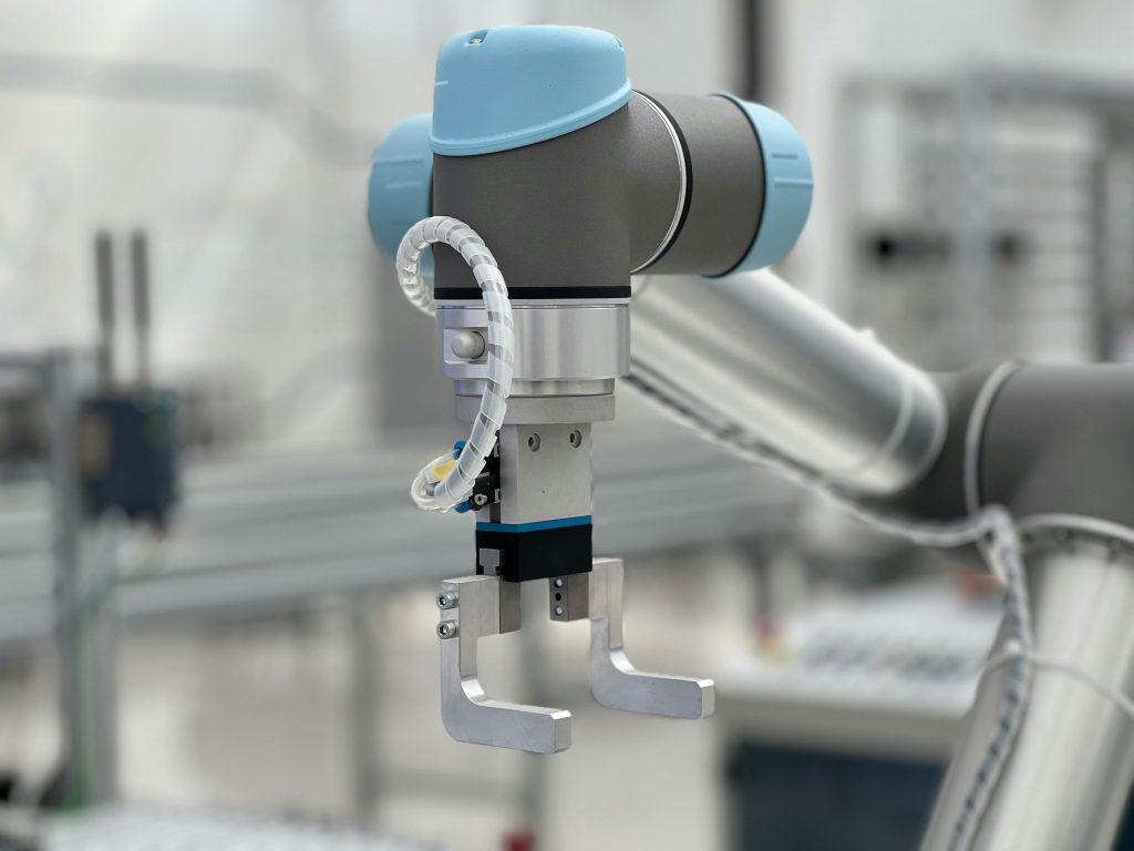 Close-up of a robotic arm in a modern industrial environment, highlighting technology.