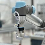 Close-up of a robotic arm in a modern industrial environment, highlighting technology.